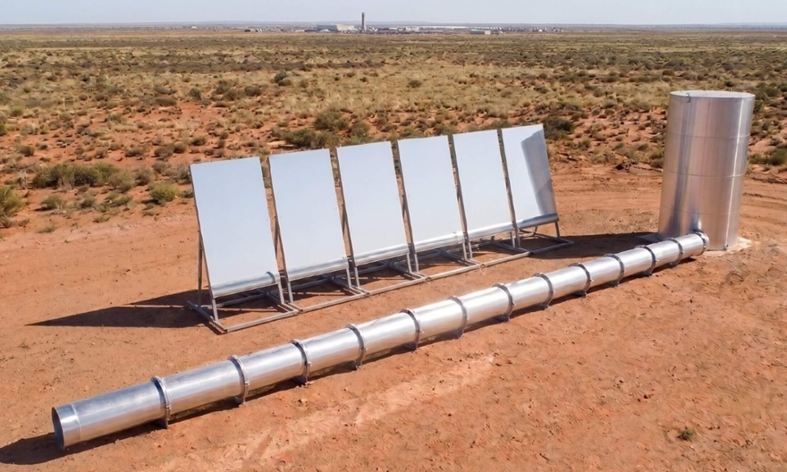 DeSolaro pilot system: solar mirror collectors aligned in arid landscape, connected to an insulated evaporation column.